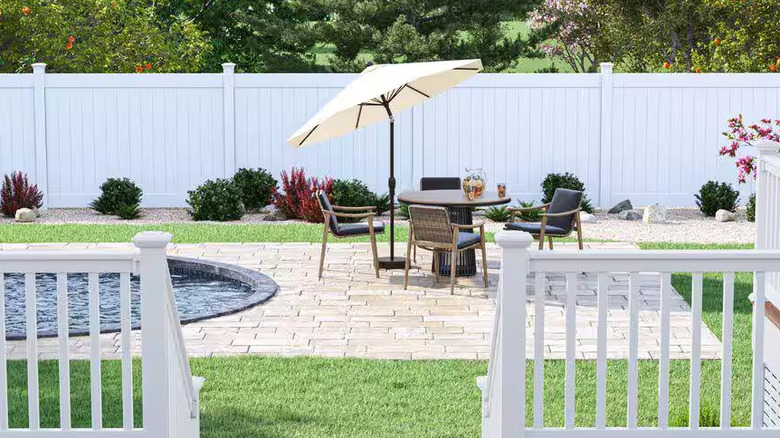 Home Depot's Veranda Linden vinyl fence panels behind patio