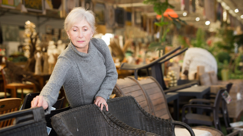 older woman shopping for patio furniture