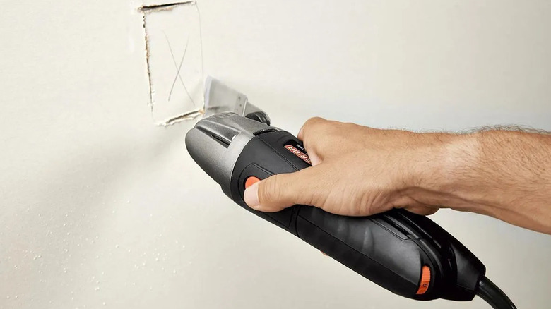 Cutting into drywall with Harbor Freight's Warrior 2-amp oscillating multi-tool
