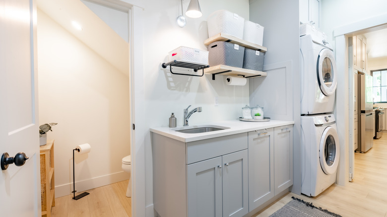 A laundry room with built-in storage