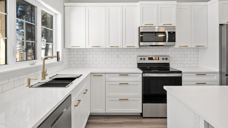 Clean and bright kitchen with white cabinets
