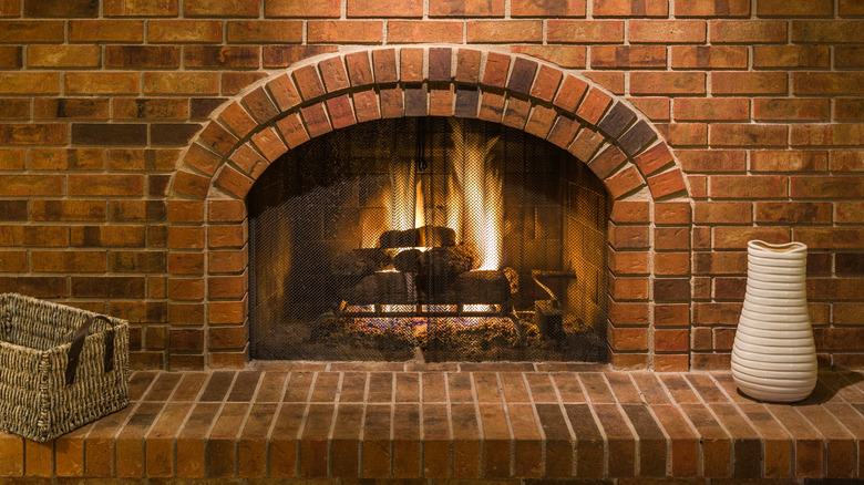 Brick fireplace with fire