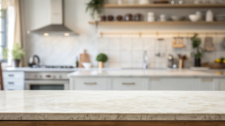 A kitchen with granite countertops.
