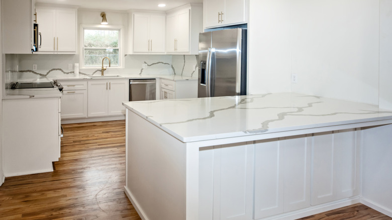 kitchen with white cabinets and countertops