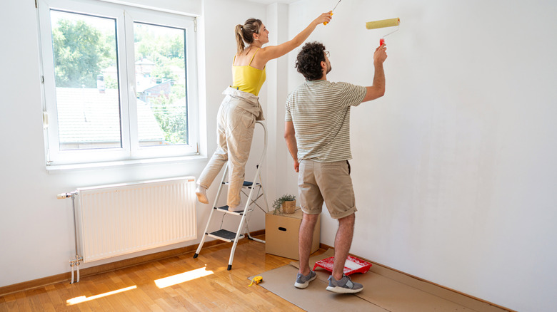 couple painting living room light color