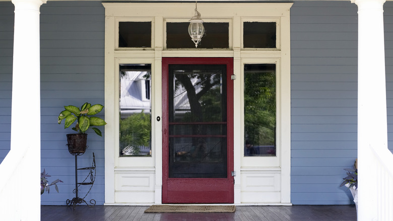 View of a front porch with a red door