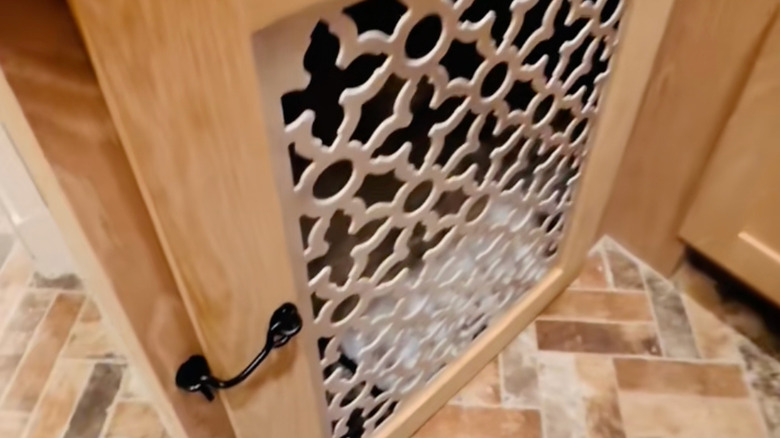 TikTokker Kimberly Burton's cabinet-based dog kennel.