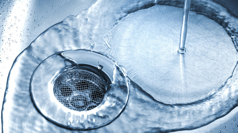 Running water in a stainless steel sink