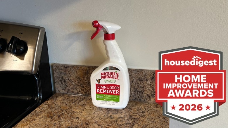 A white bottle of Nature's Miracle Stain and Odor Remover sitting on a countertop