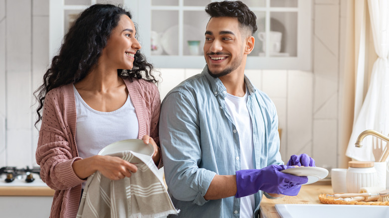 couple washing dishes