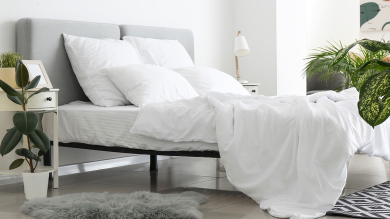 bed with white sheets