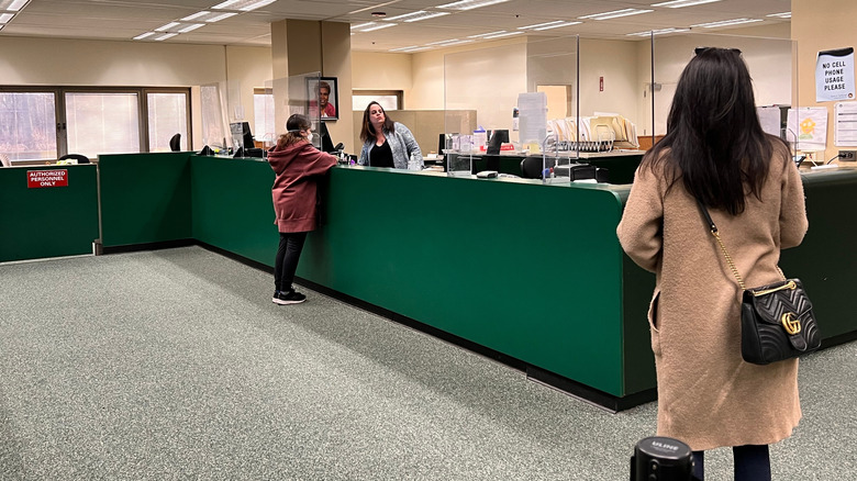 Residents stand in line at a tax assessors office