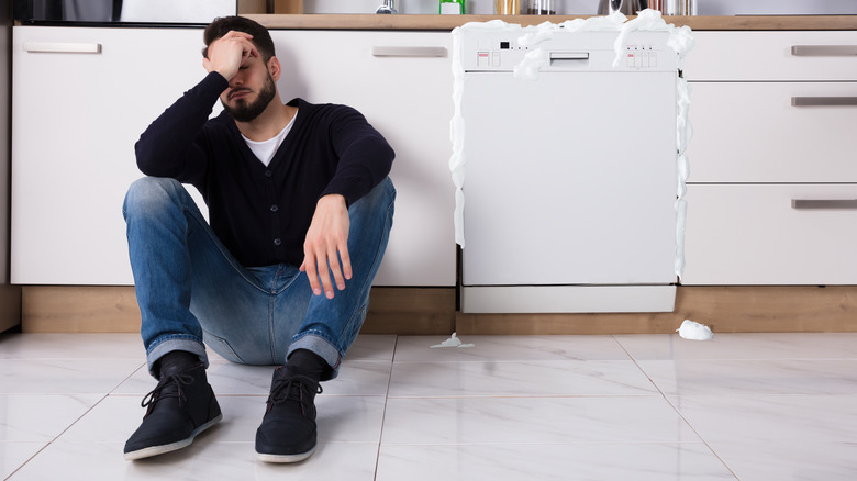 Sudsy overflowing dishwasher