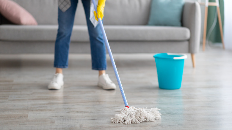 person mopping floor