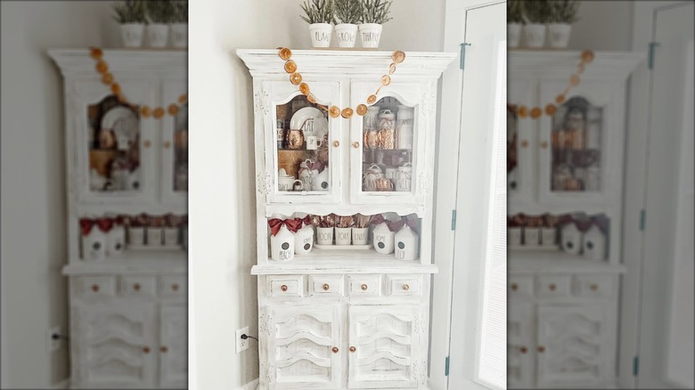 White corner hutchs with dishware