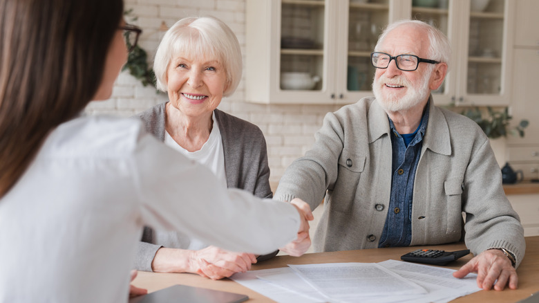 Older couple with paperwork