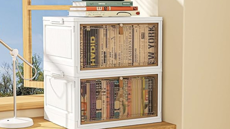 Product image of 4-tier rolling organizing bin broken up in two tiers, holding books on top of a desk.