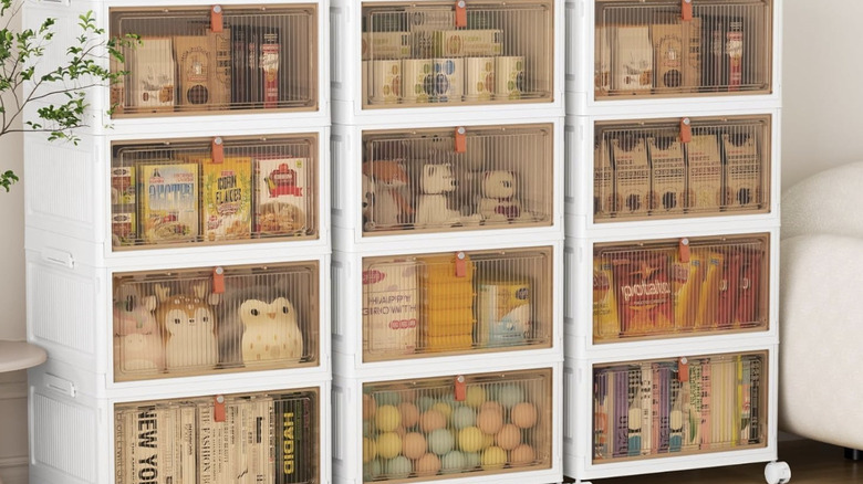 Product image of 4-tier rolling organizing bin, holding kids toys, pantry items, and books.