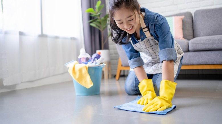 Woman scrubbing the floors