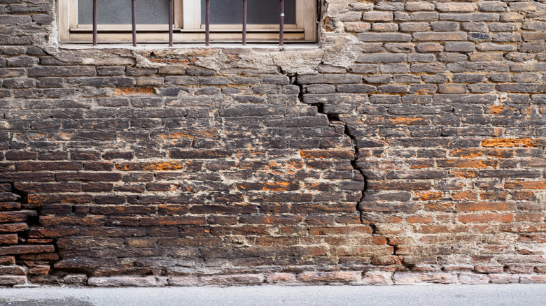 Damaged and aged brick house
