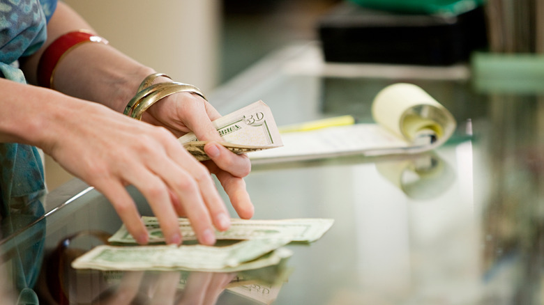 Cashier offering cash back