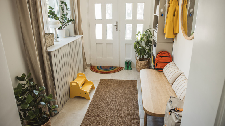 Clean, calm, and well-organized entryway with no clutter
