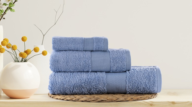 stacked blue bathroom towels