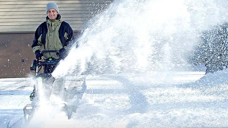 The EGO cordless snow blower being used