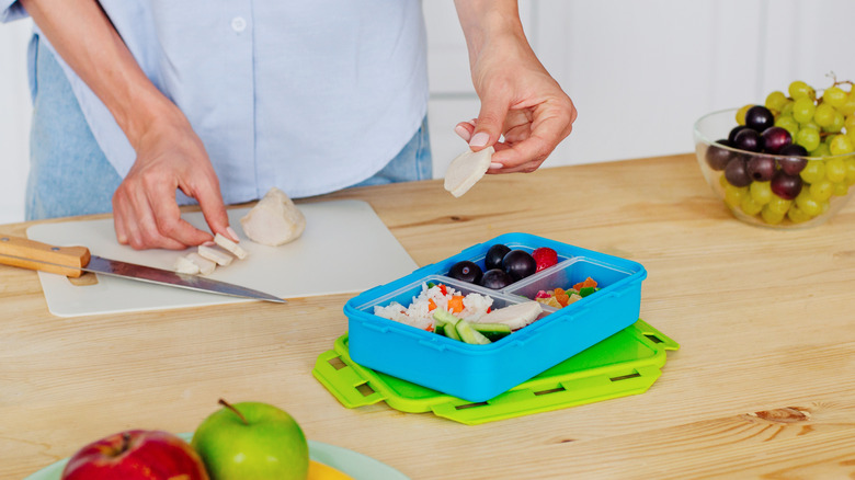 Person making snack boxes
