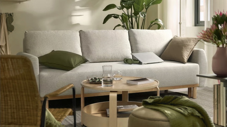 A styled IKEA GRUNNARP sleeper sofa in beige
