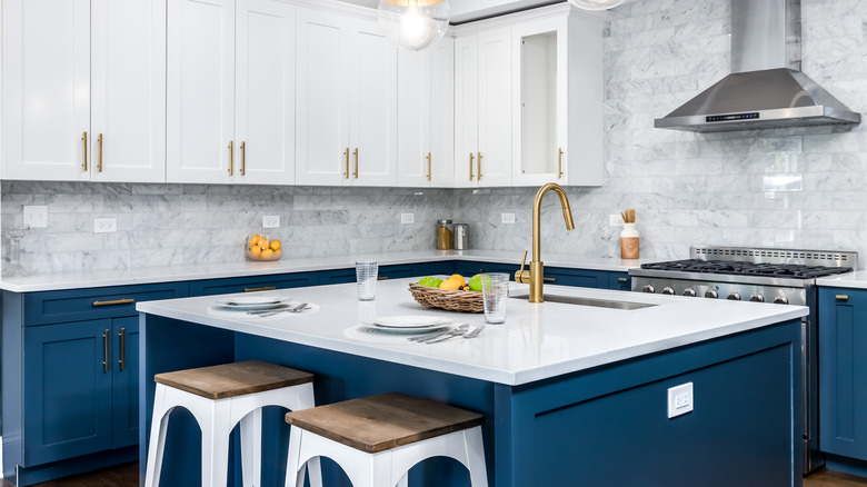white, blue and gold kitchen