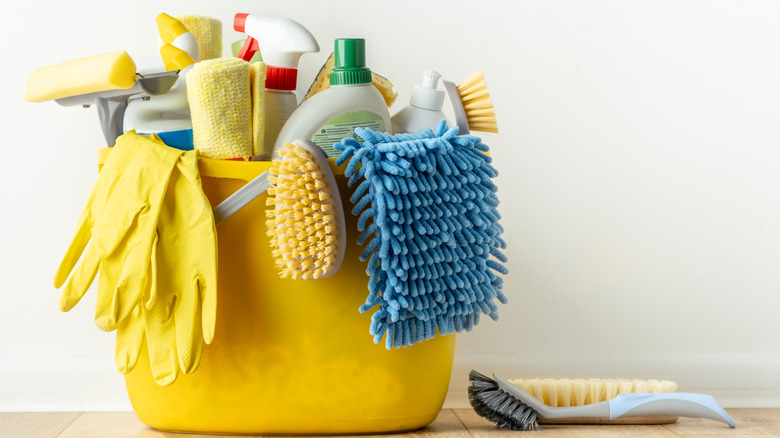 bucket of cleaning supplies on floor