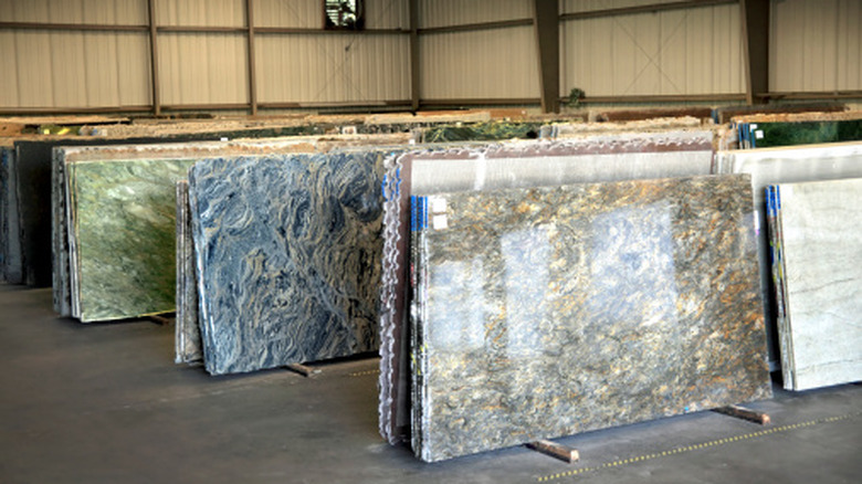 Slabs of different types of countertop materials in a warehouse