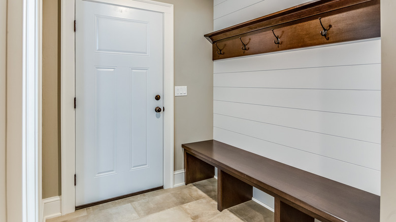 Wooden built in bench in mudroom