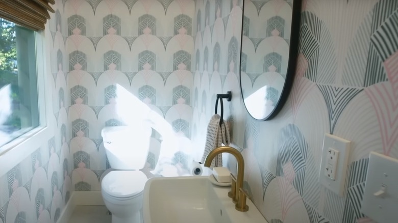 wallpapered bathroom on Fixer to Fabulous
