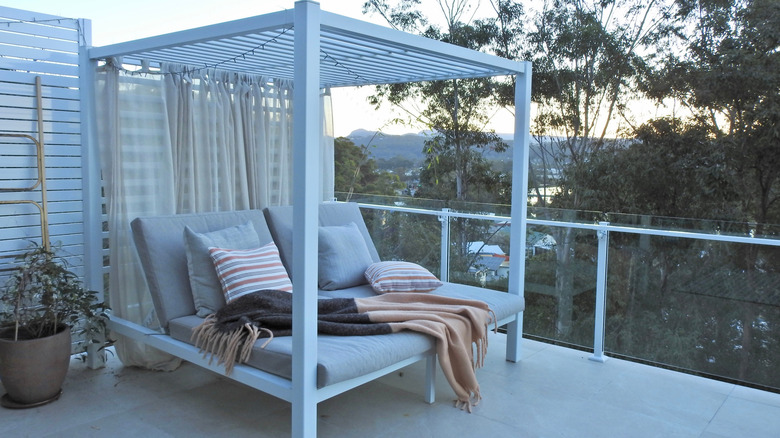 covered daybed with curtains