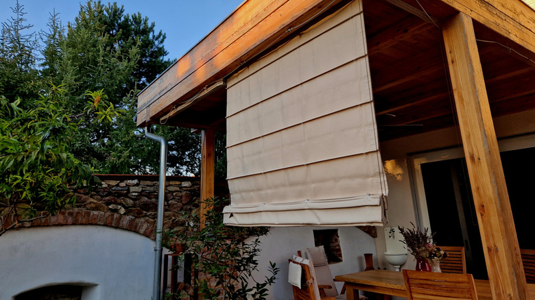 backyard pergola featuring pleated curtain shades