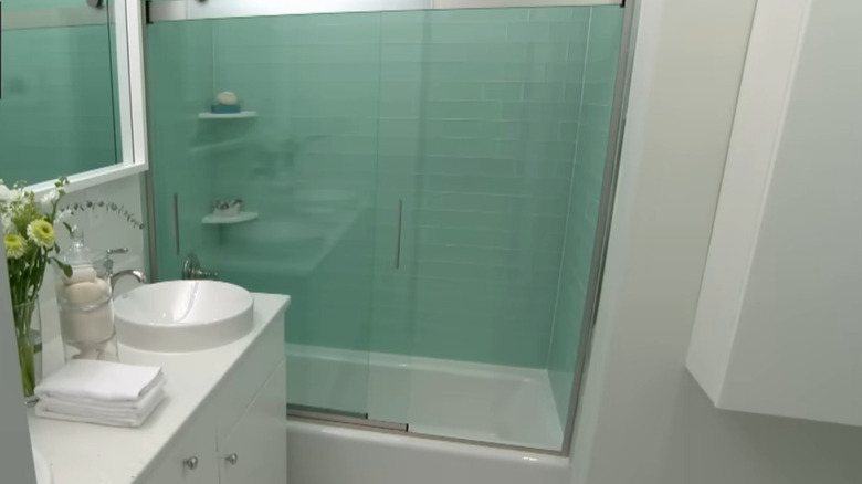 bathroom with green glass tile