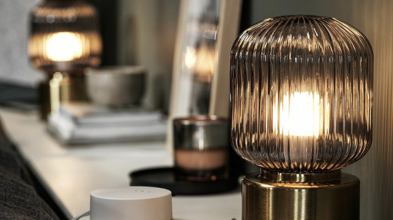 IKEA SOLKLINT table lamps on a shelf