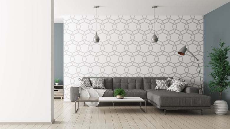 Geometric wallpaper with simple sofa and decor