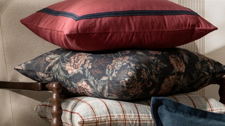 Stack of throw pillows in different colors and patterns