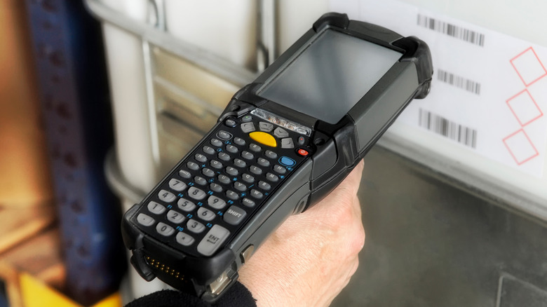 Price scanner gun checking barcodes