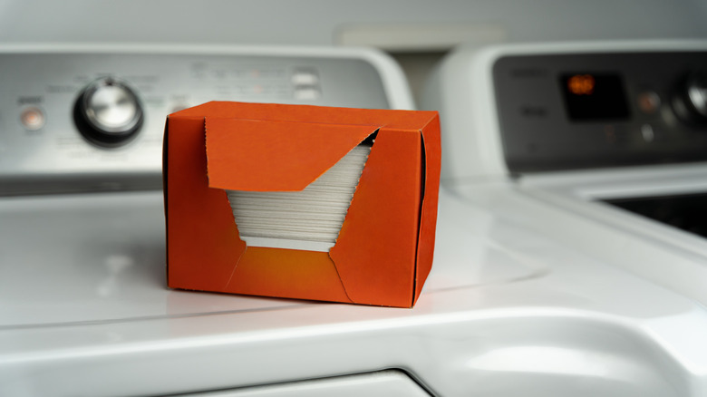 open box of dryer sheets sitting on top of dryer