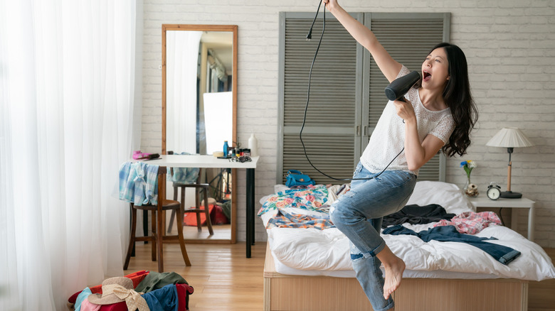 Woman dancing and unpacking