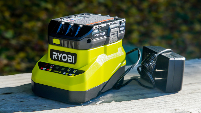 A Ryobi battery and charger on a table