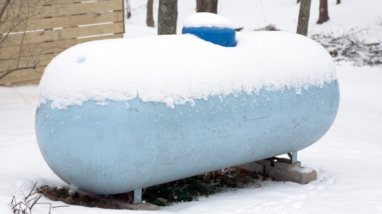 Large propane tank covered in snow
