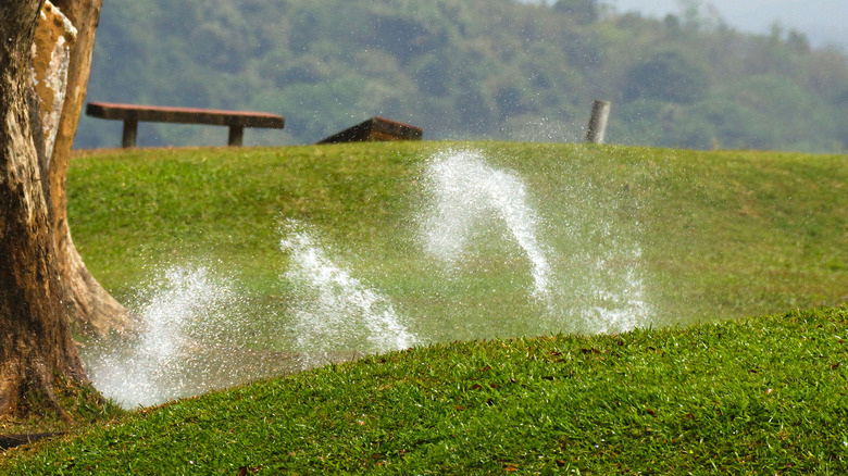 Watering a lawn with significant slopes and hills