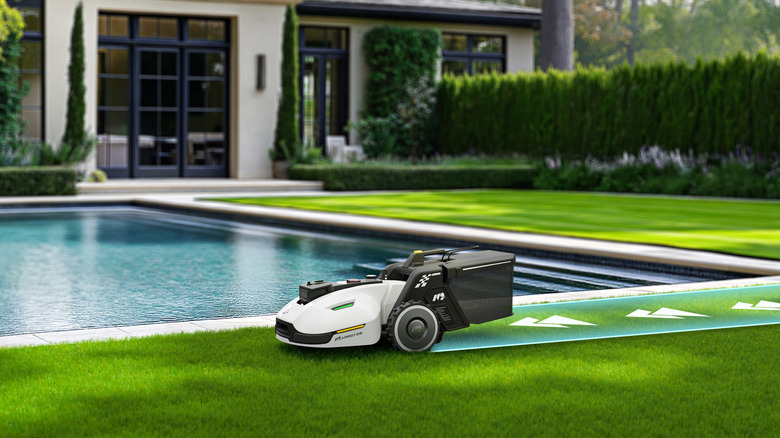 A robot mower on its route near a pool