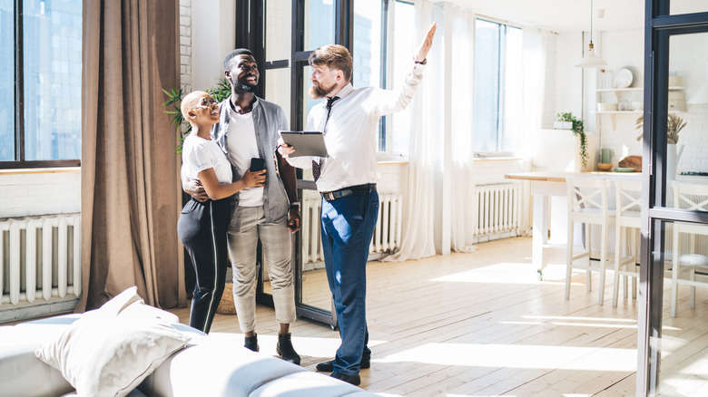 couple and real estate agent