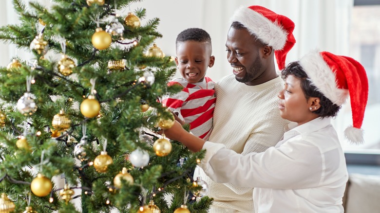 family decorating tree